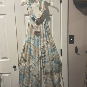 Brand new from Key West, FL. Multi-colored halter part ties behind neck.